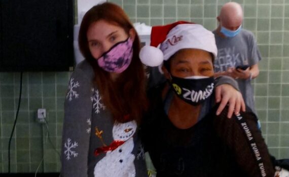 A loved teacher with her student for a Christmas celebration.